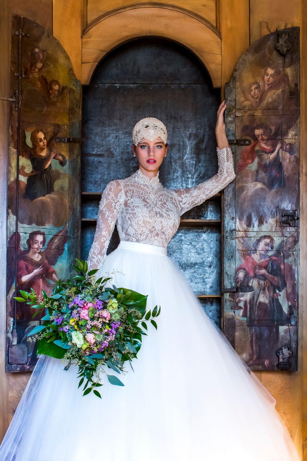 high class bride with flowers in a castle